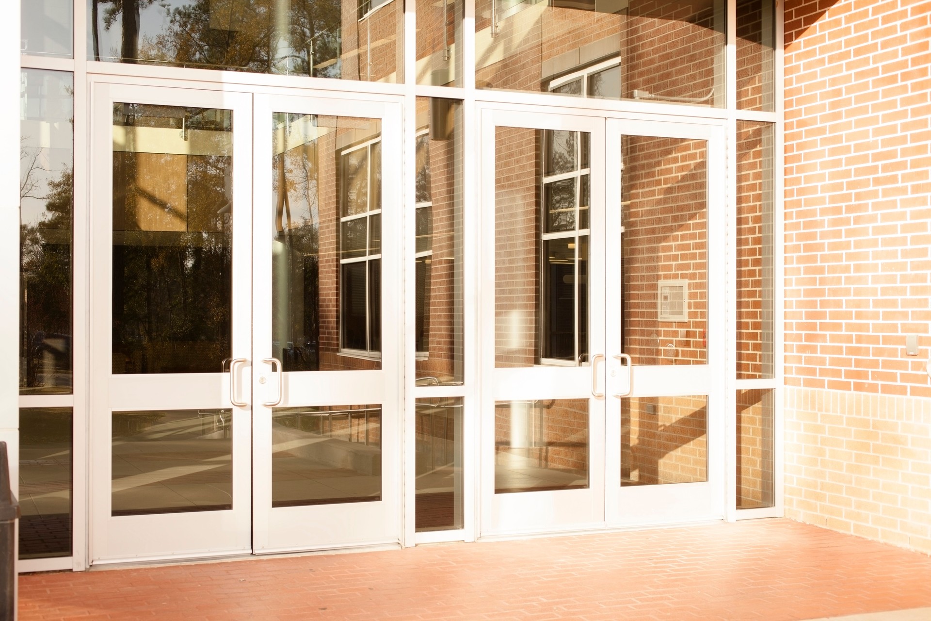 Business: Empty office building, school.  Front doors are closed.